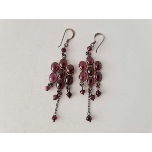 626 - A pair of silver decorative cabochon garnet earrings