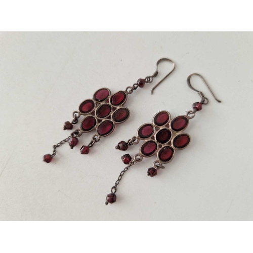 626 - A pair of silver decorative cabochon garnet earrings