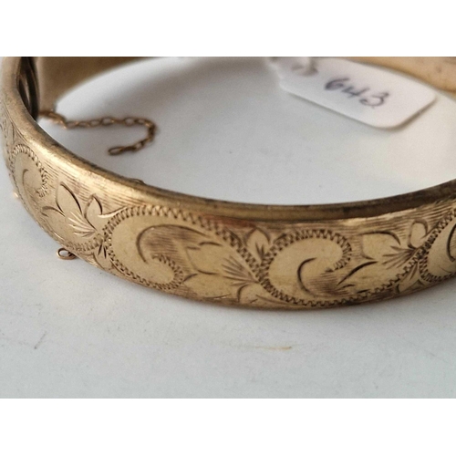 643 - A rolled gold hinged bangle