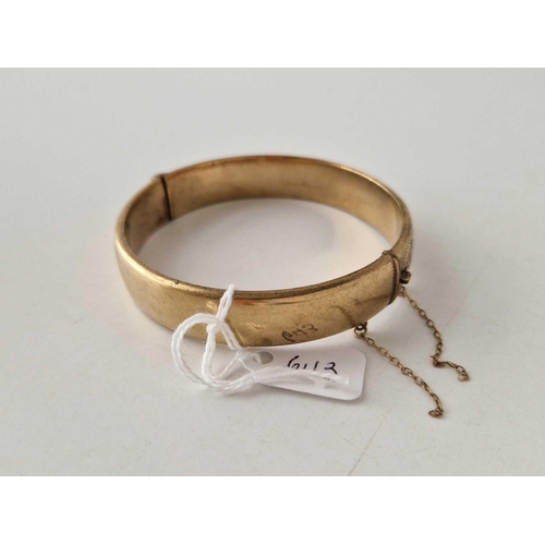 643 - A rolled gold hinged bangle