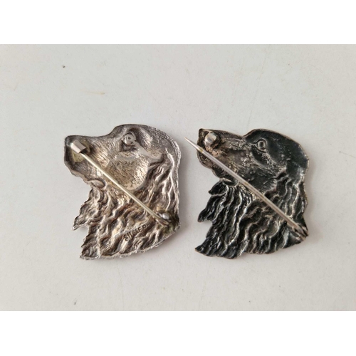 656 - A pair of silver dog brooches