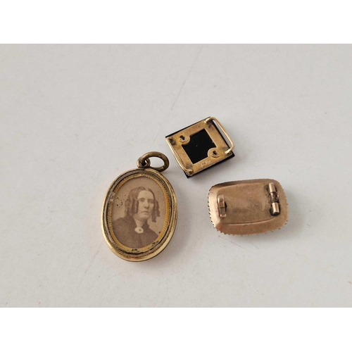 663 - A gold fronted locket with anchor motif, mourning brooch, etc