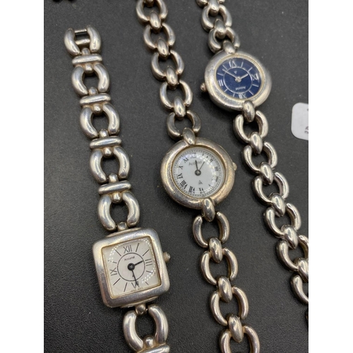 706 - Three heavy silver wrist watches on straps, one with spare link, 145 g