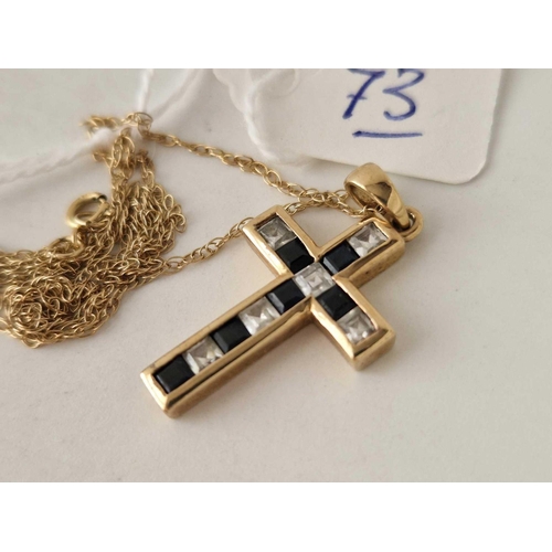 73 - A sapphire & white stone 9ct cross on 9ct chain 3.2g