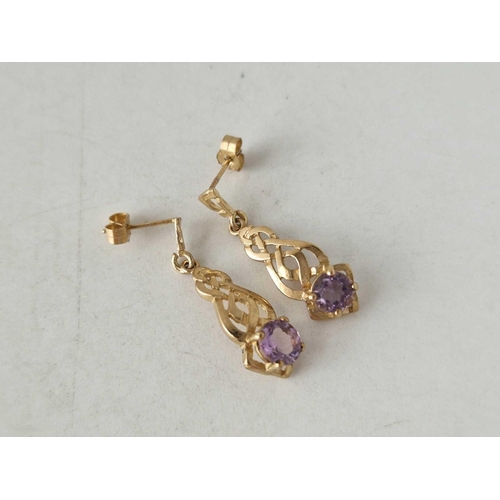 83 - A pair of amethyst drop earrings 9ct 1.7 gms