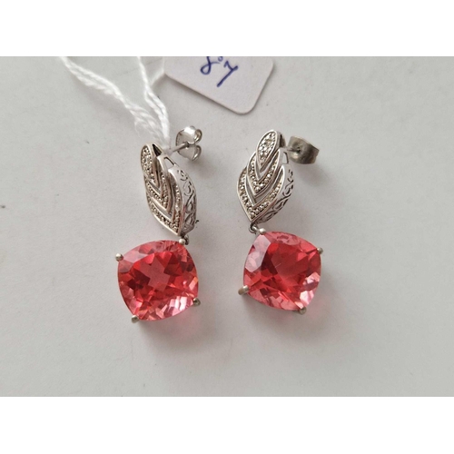 87 - A pair of large silver stone set earrings