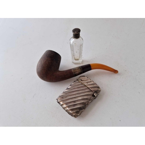 876 - A vesta case, London 1891, an amber mounted pipe and a small scent phial