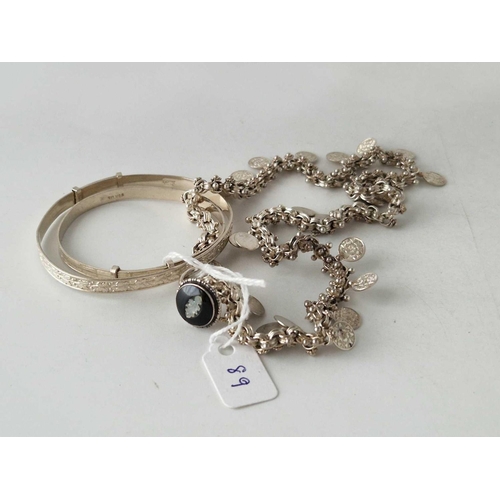 89 - A silver necklace two bracelets and a ring 37 gms