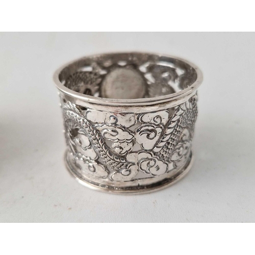 921 - A Chinese napkin ring decorated with a Dragon and another English