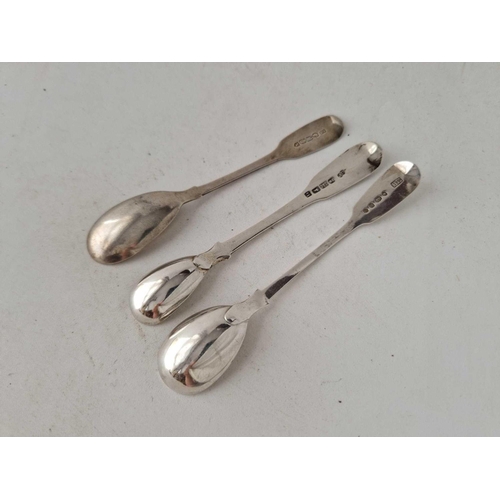 927 - An Irish crested mustard spoon, an Exeter mustard spoon 1824 and another, 41g