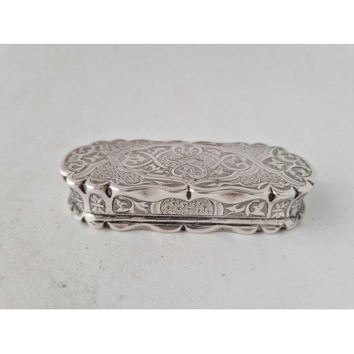 935 - A good Victorian shaped snuff box engraved with scrolls etc, 3.5 inches long, Birmingham 1873 by FM?... 