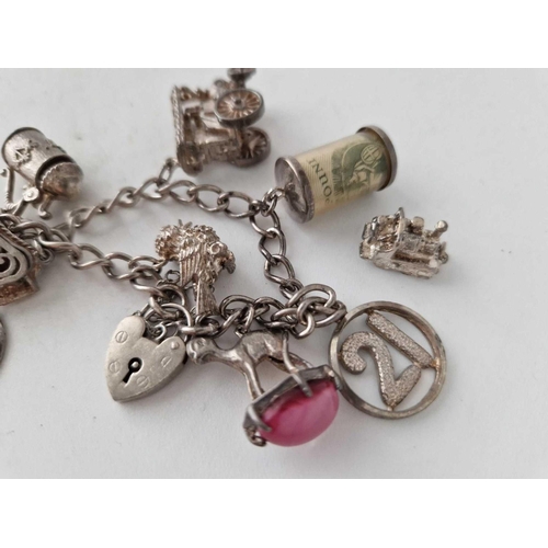 938 - A silver charm bracelet, 55 g