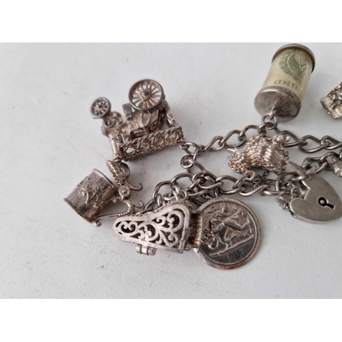 938 - A silver charm bracelet, 55 g