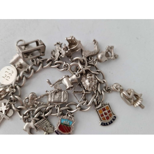 939 - A silver charm bracelet, 55 g