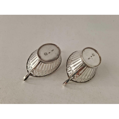 953 - A pair of Dutch silver boat shaped dishes, each with two loop handles, 3.5 inches wide