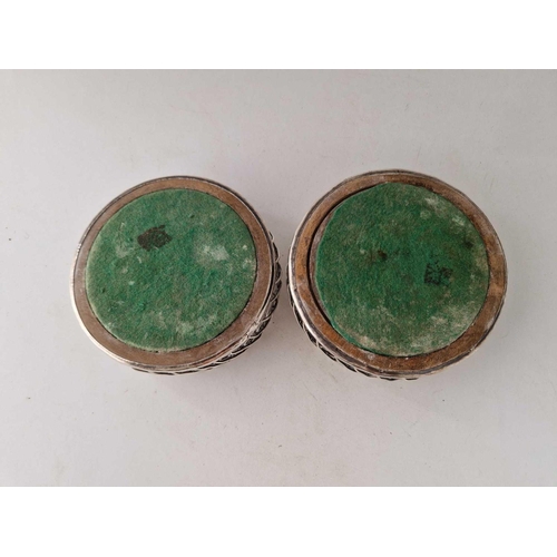 972 - A pair of Georgian wine coasters with wire work sides and wood bases with silver bosses, 5.5 inches ... 