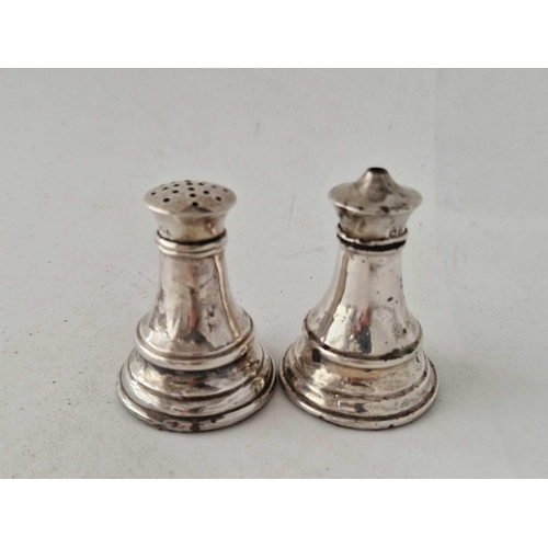 974 - A pair of lighthouse shaped cruets, 2.25 inches high