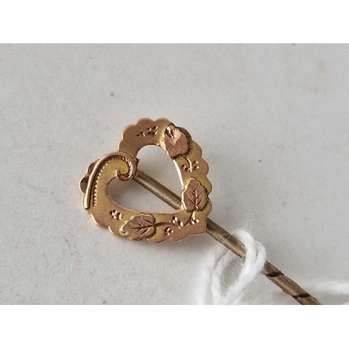 98 - A heart topped stick pin 9ct