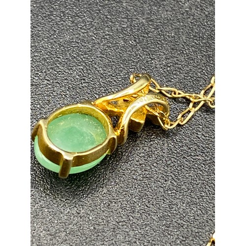 68 - A fine oval good colour green jade and diamond pendant, 14ct on 18ct 18