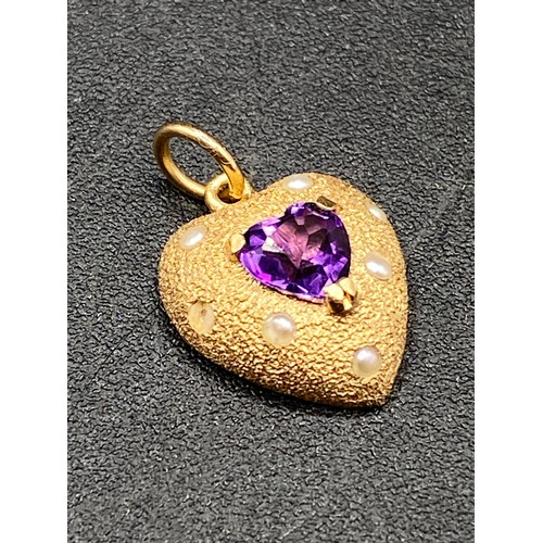 235 - An antique amethyst pearl heart shaped pendant in high carat gold