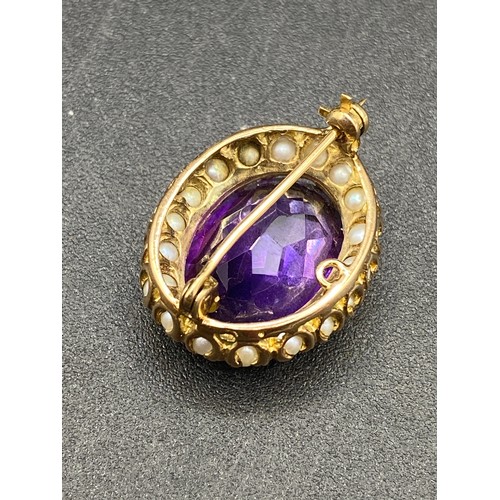 237 - An amethyst and pearl brooch in high carat