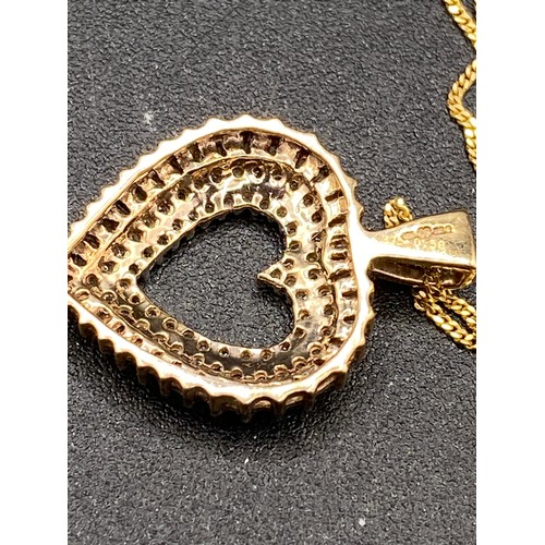 383 - A fine diamond heart Pendant with round and baguette diamonds on 18