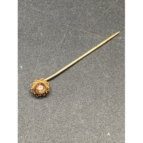 384 - An antique fancy diamond circular mounted stick pin