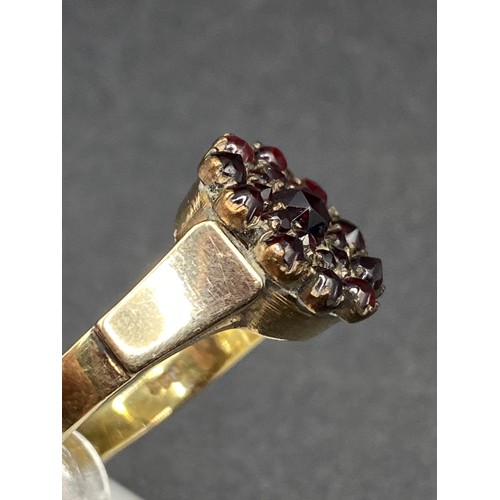 556 - A Victorian Garnet Cluster Ring, high carat head, size N on High Ct gold band