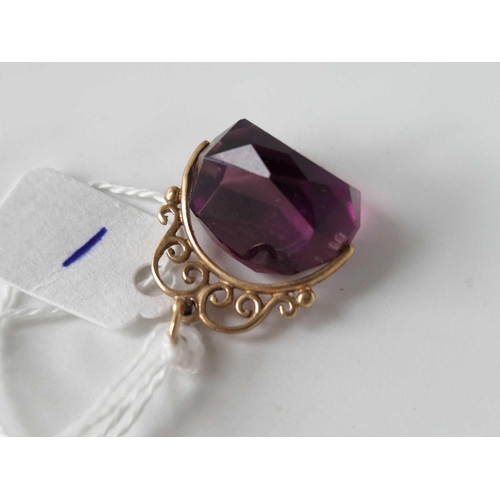 1 - A amethyst coloured revolving seal with gold scroll mount