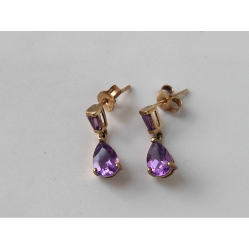 102 - A pair of pear cut amethyst drop earrings 9ct