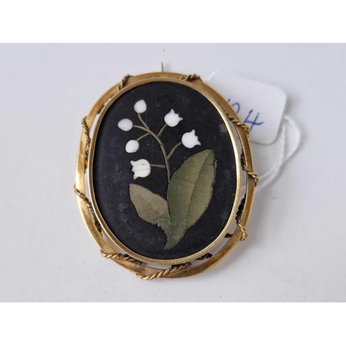 124 - A pietra dura brooch in gold mount