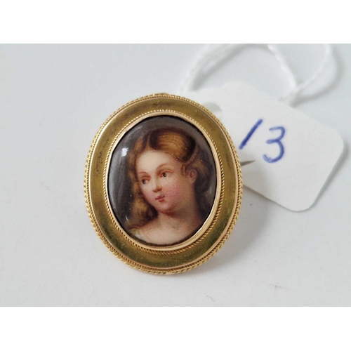 13 - A 19th century brooch with a painted lady 15ct gold 5 gms