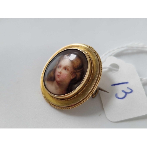 13 - A 19th century brooch with a painted lady 15ct gold 5 gms