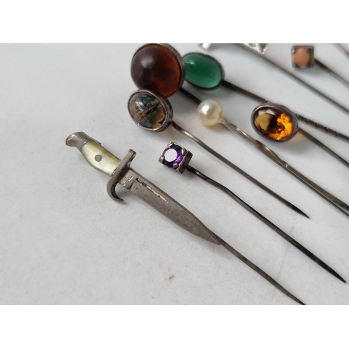 145 - Selection of 10 stickpins one a cross with green gem coral amethyst and a miniature dagger with moth... 