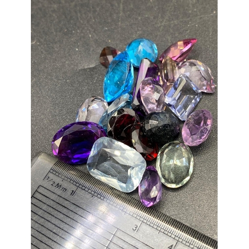 174 - A bag of coloured gem stones ex jewellers stock