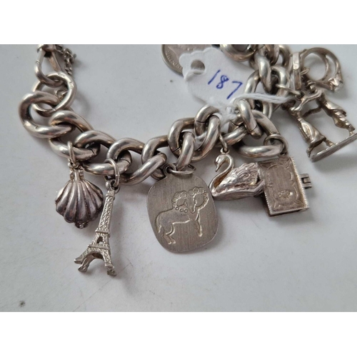 187 - A silver charm bracelet 7 inch 73 gms