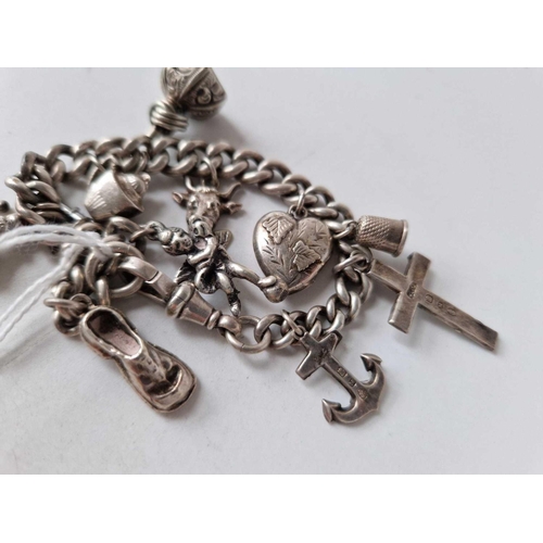 2 - A silver charm bracelet with antique seal and tassel end