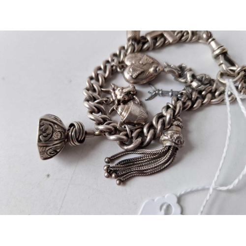 2 - A silver charm bracelet with antique seal and tassel end