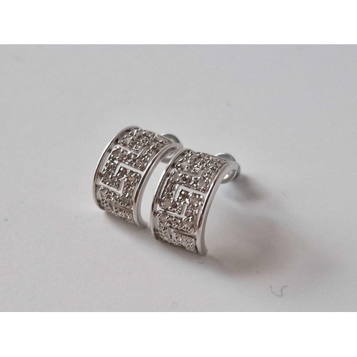 206 - A pair of white gold diamond Greek styler earrings 9ct 3.1 gms