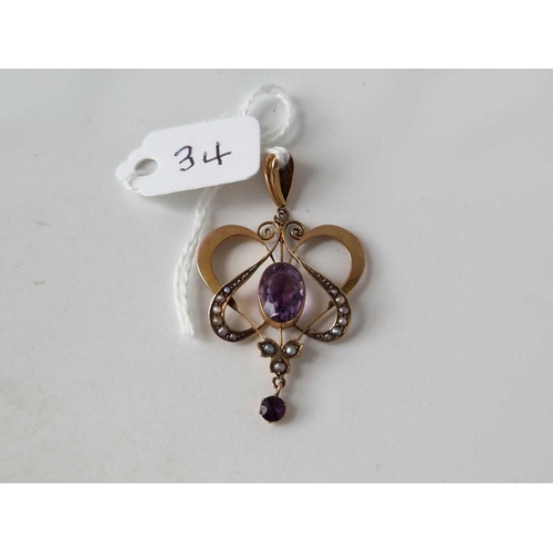 34 - A Edwardian amethyst and half pearls Art Nouveau pendant 9ct