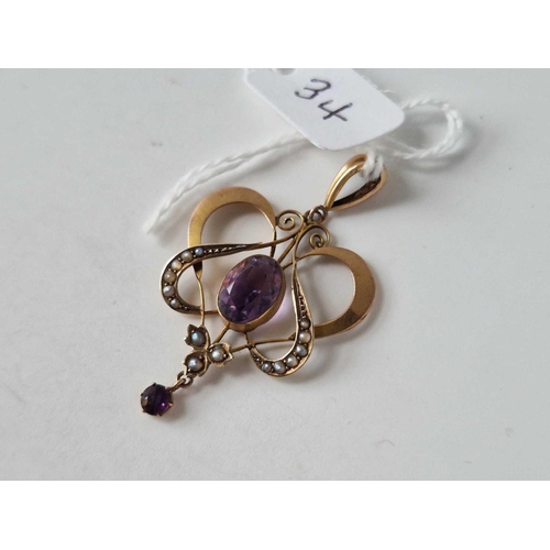 34 - A Edwardian amethyst and half pearls Art Nouveau pendant 9ct