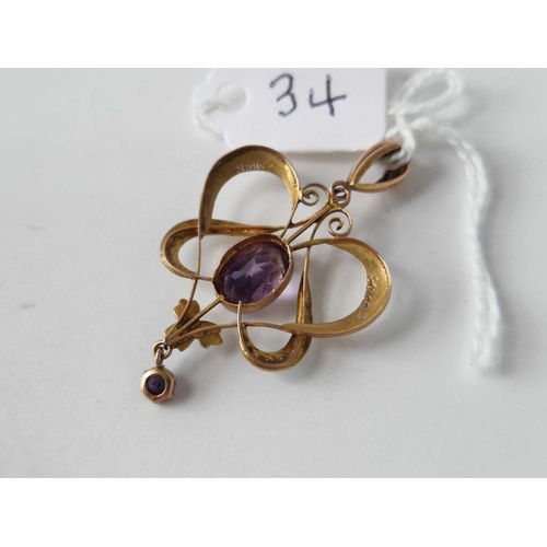 34 - A Edwardian amethyst and half pearls Art Nouveau pendant 9ct