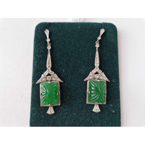 37 - A pair of silver antique drop earrings set with white and green carved paste stones