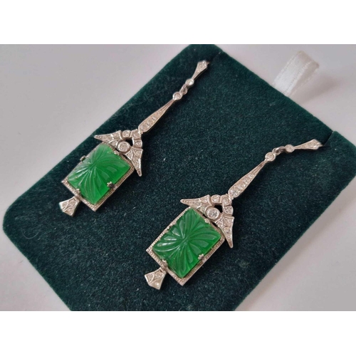 37 - A pair of silver antique drop earrings set with white and green carved paste stones