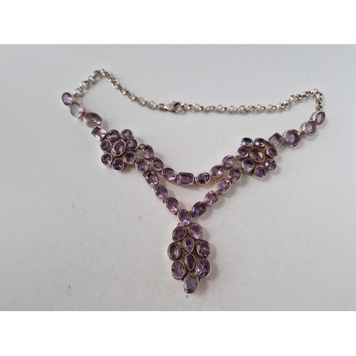 63 - AN IMPRESSIVE AMETHYST NECKLACE SET WITH 49 LARGE STONES 1ct to 5.5ct all in silver 76.8g