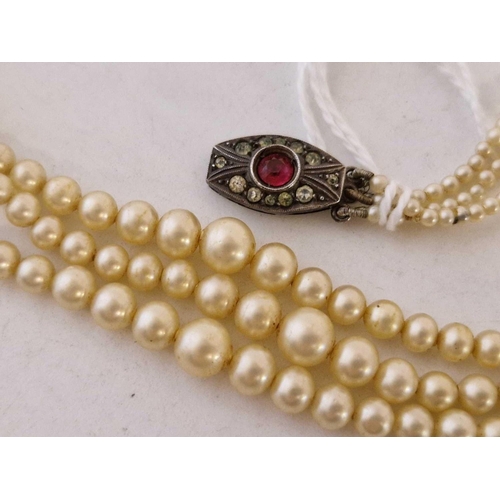 10 - A gradated pearl necklace with silver and stone set clasp 14 inch