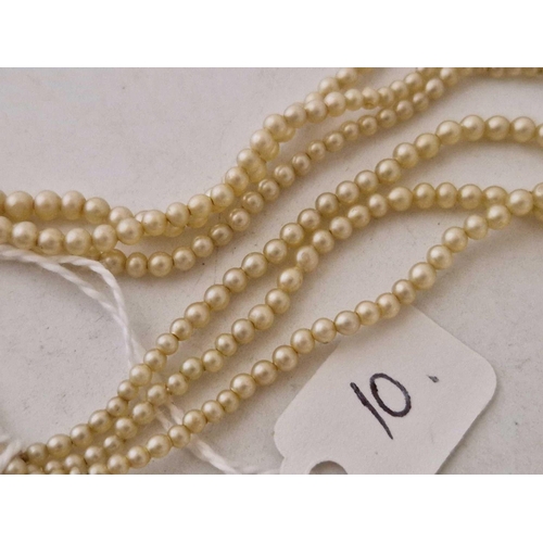 10 - A gradated pearl necklace with silver and stone set clasp 14 inch