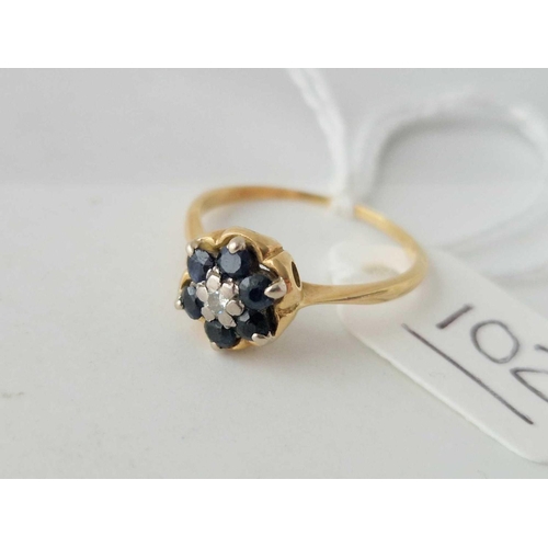 102 - A sapphire and diamond ring 18ct gold size O 2.6 gms