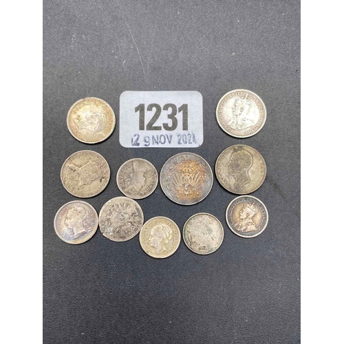 1231 - Bag of silver coins, 21g