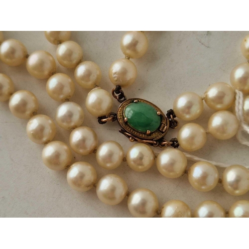 139 - A double strand of cultured pearls 14 inch